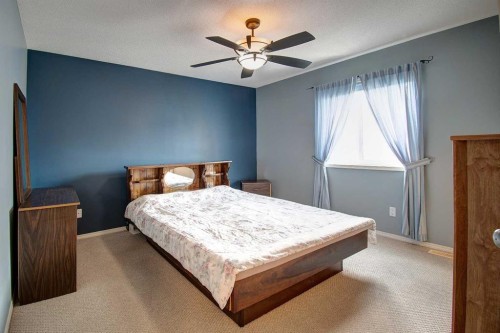 209 Sagewood Place Sw, Airdrie, AB - Indoor Photo Showing Bedroom