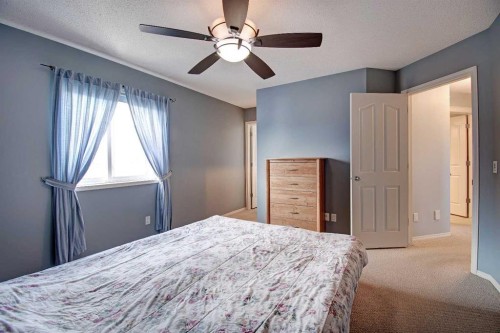 209 Sagewood Place Sw, Airdrie, AB - Indoor Photo Showing Bedroom