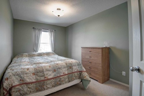 209 Sagewood Place Sw, Airdrie, AB - Indoor Photo Showing Bedroom