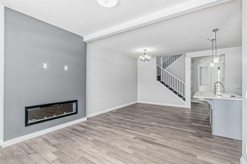 37 Southborough Lane, Cochrane, AB - Indoor Photo Showing Living Room With Fireplace