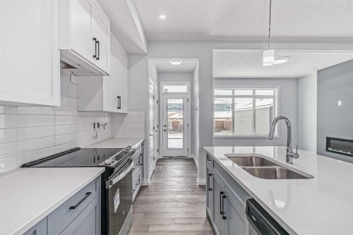 37 Southborough Lane, Cochrane, AB - Indoor Photo Showing Kitchen With Double Sink With Upgraded Kitchen