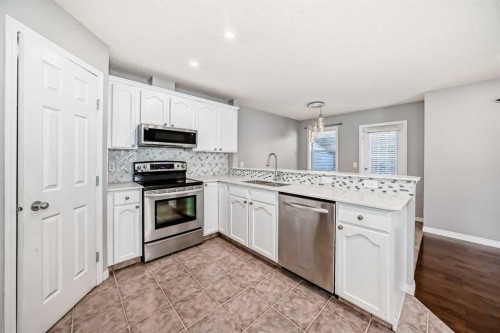 95 Hidden Creek Rise Nw, Calgary, AB - Indoor Photo Showing Kitchen With Stainless Steel Kitchen