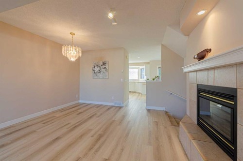 19 Sandarac Road Nw, Calgary, AB - Indoor With Fireplace