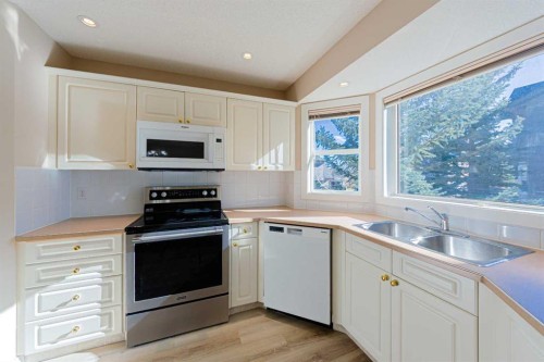 19 Sandarac Road Nw, Calgary, AB - Indoor Photo Showing Kitchen With Double Sink