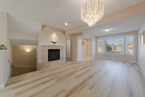 19 Sandarac Road Nw, Calgary, AB - Indoor With Fireplace
