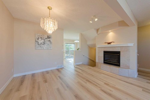 19 Sandarac Road Nw, Calgary, AB - Indoor Photo Showing Living Room With Fireplace