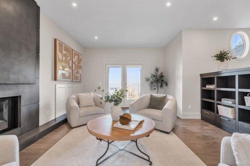 625 Britannia Drive Sw, Calgary, AB - Indoor Photo Showing Living Room With Fireplace