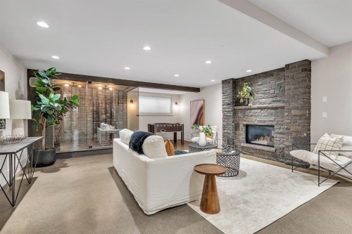 625 Britannia Drive Sw, Calgary, AB - Indoor Photo Showing Living Room With Fireplace