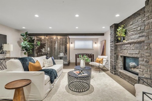 625 Britannia Drive Sw, Calgary, AB - Indoor Photo Showing Living Room With Fireplace