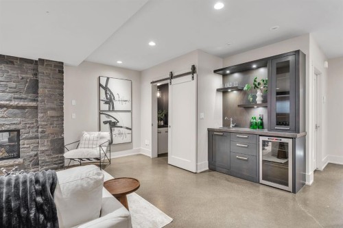 625 Britannia Drive Sw, Calgary, AB - Indoor Photo Showing Living Room With Fireplace