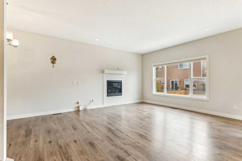 118 Saddlestone Park Ne, Calgary, AB - Indoor Photo Showing Living Room With Fireplace