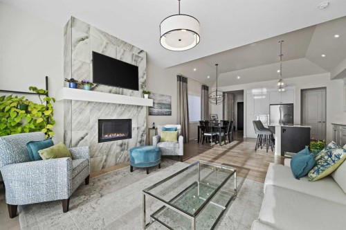 12 Cranbrook Mews Se, Calgary, AB - Indoor Photo Showing Living Room With Fireplace