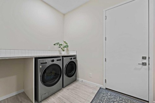 12 Cranbrook Mews Se, Calgary, AB - Indoor Photo Showing Laundry Room