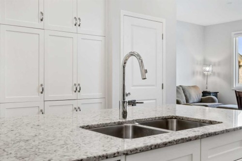 76 Legacy Glen Row Se, Calgary, AB - Indoor Photo Showing Kitchen With Double Sink
