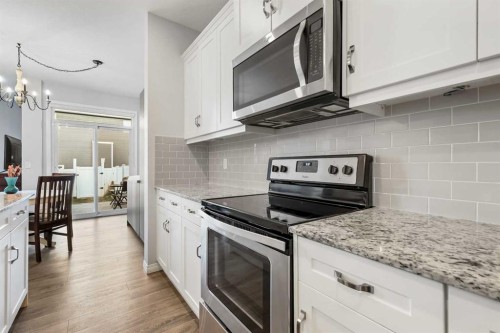 76 Legacy Glen Row Se, Calgary, AB - Indoor Photo Showing Kitchen With Stainless Steel Kitchen With Upgraded Kitchen