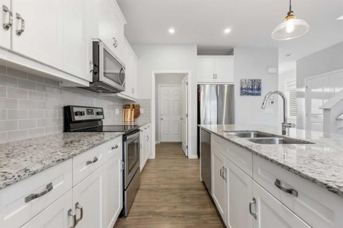 76 Legacy Glen Row Se, Calgary, AB - Indoor Photo Showing Kitchen With Stainless Steel Kitchen With Double Sink With Upgraded Kitchen