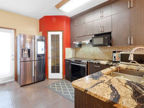 622 Saddlecreek Way Ne, Calgary, AB - Indoor Photo Showing Kitchen With Double Sink With Upgraded Kitchen