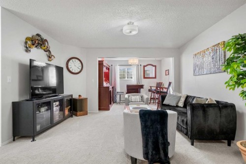 1208 Millrise Point Sw, Calgary, AB - Indoor Photo Showing Living Room