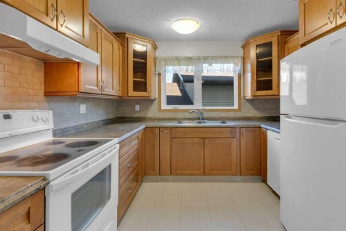 88 Bermondsey Crescent Nw, Calgary, AB - Indoor Photo Showing Kitchen With Double Sink