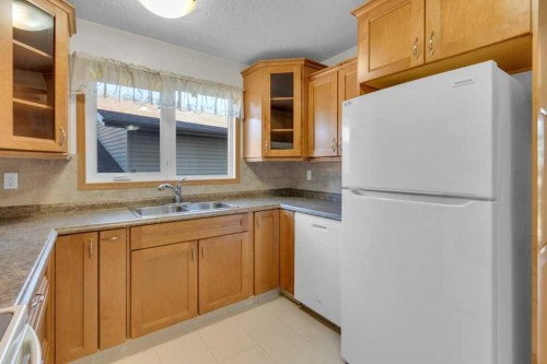 88 Bermondsey Crescent Nw, Calgary, AB - Indoor Photo Showing Kitchen With Double Sink