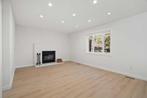 327 Canyon Close, Canmore, AB - Indoor Photo Showing Living Room With Fireplace