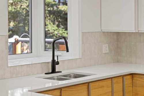 327 Canyon Close, Canmore, AB - Indoor Photo Showing Kitchen With Double Sink