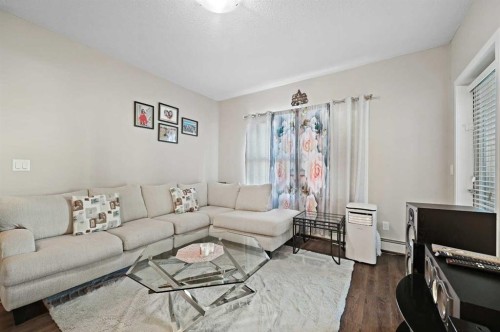 102-200 Cranfield Common Se, Calgary, AB - Indoor Photo Showing Living Room