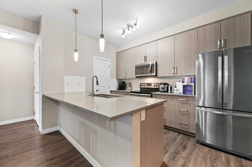 102-200 Cranfield Common Se, Calgary, AB - Indoor Photo Showing Kitchen With Upgraded Kitchen