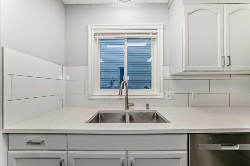 10134 Hidden Valley Drive Nw, Calgary, AB - Indoor Photo Showing Kitchen With Double Sink