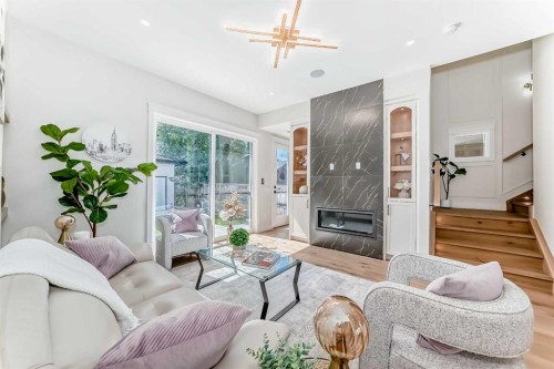 2313 23 Avenue Sw, Calgary, AB - Indoor Photo Showing Living Room With Fireplace