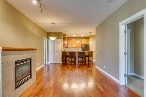 2201-24 Hemlock Crescent Sw, Calgary, AB - Indoor Photo Showing Living Room With Fireplace