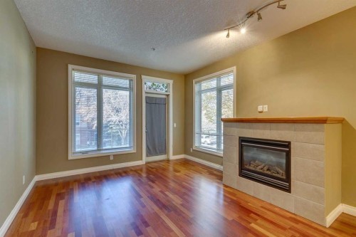 2201-24 Hemlock Crescent Sw, Calgary, AB - Indoor Photo Showing Living Room With Fireplace