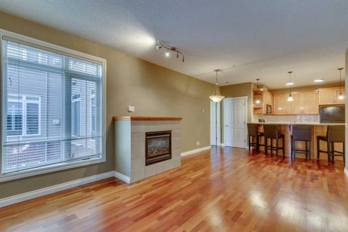2201-24 Hemlock Crescent Sw, Calgary, AB - Indoor Photo Showing Living Room With Fireplace