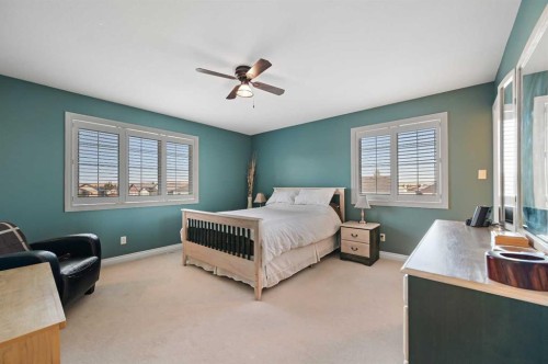 60 Canoe Cove Sw, Airdrie, AB - Indoor Photo Showing Bedroom