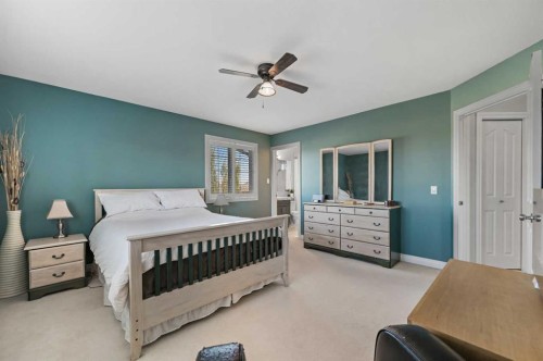 60 Canoe Cove Sw, Airdrie, AB - Indoor Photo Showing Bedroom