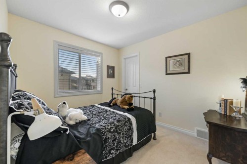 60 Canoe Cove Sw, Airdrie, AB - Indoor Photo Showing Bedroom