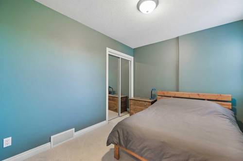 60 Canoe Cove Sw, Airdrie, AB - Indoor Photo Showing Bedroom