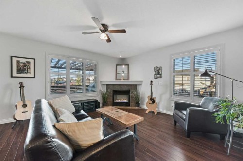 60 Canoe Cove Sw, Airdrie, AB - Indoor Photo Showing Living Room With Fireplace