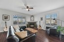 60 Canoe Cove Sw, Airdrie, AB  - Indoor Photo Showing Living Room With Fireplace 
