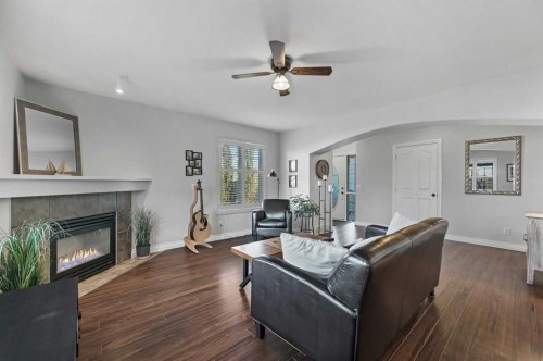 60 Canoe Cove Sw, Airdrie, AB - Indoor Photo Showing Living Room With Fireplace