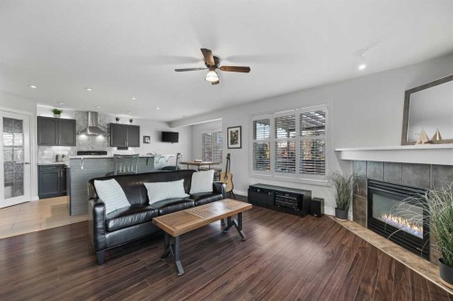 60 Canoe Cove Sw, Airdrie, AB - Indoor Photo Showing Living Room With Fireplace