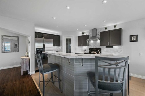 60 Canoe Cove Sw, Airdrie, AB - Indoor Photo Showing Kitchen With Upgraded Kitchen