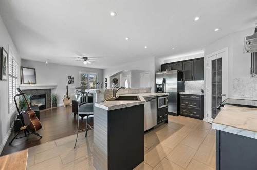 60 Canoe Cove Sw, Airdrie, AB - Indoor Photo Showing Kitchen With Upgraded Kitchen