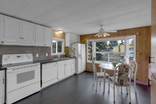 47 Huntstrom Drive Ne, Calgary, AB - Indoor Photo Showing Kitchen With Double Sink