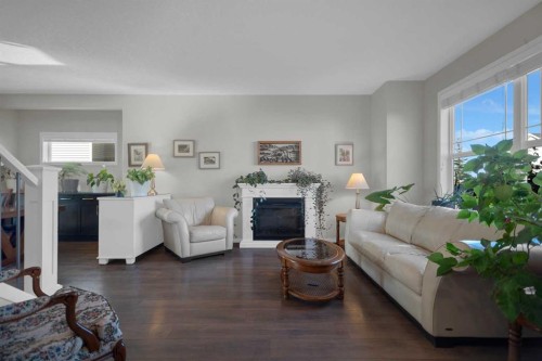 61 Cranford Place Se, Calgary, AB - Indoor Photo Showing Living Room With Fireplace