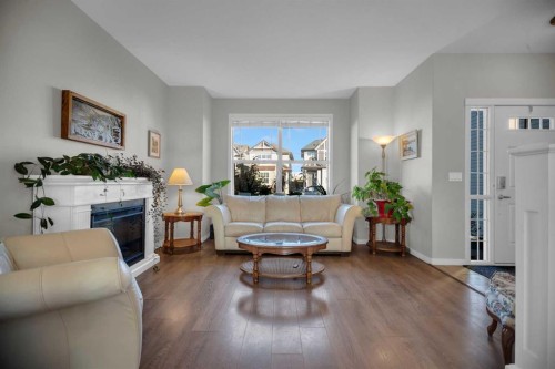 61 Cranford Place Se, Calgary, AB - Indoor Photo Showing Living Room With Fireplace