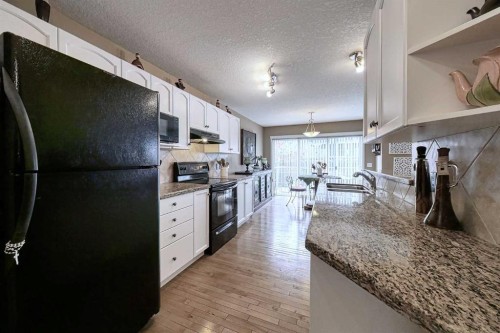 73 Everwoods Road Sw, Calgary, AB - Indoor Photo Showing Kitchen With Double Sink