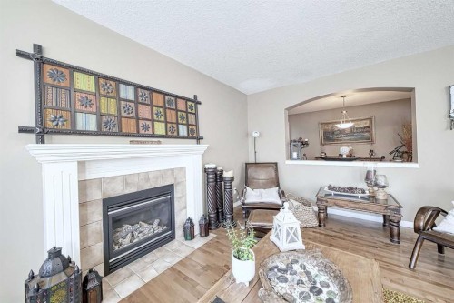 73 Everwoods Road Sw, Calgary, AB - Indoor Photo Showing Living Room With Fireplace