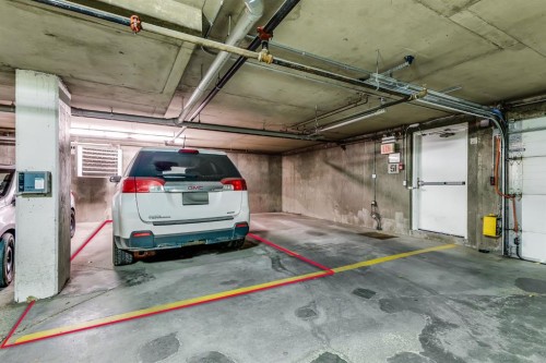 7308-304 Mackenzie Way Sw, Airdrie, AB - Indoor Photo Showing Garage