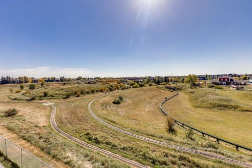 7308-304 Mackenzie Way Sw, Airdrie, AB - Outdoor With View